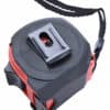 Close-up of a black and red tape measure with a strap and side clip.