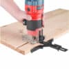 A person uses a 510W Bending milling machine on a wooden board with a guide for precision.