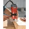 A person using a 510W Bending milling machine on wood.