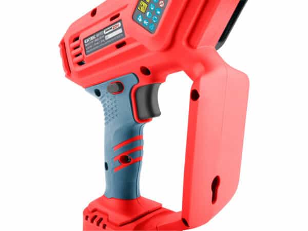 Close-up of a red and blue cordless power tool with a textured handle, buttons, and a display screen.