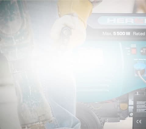 A gloved person holds a tool by a blue "Max 5500W" machine in a bright, faded image.